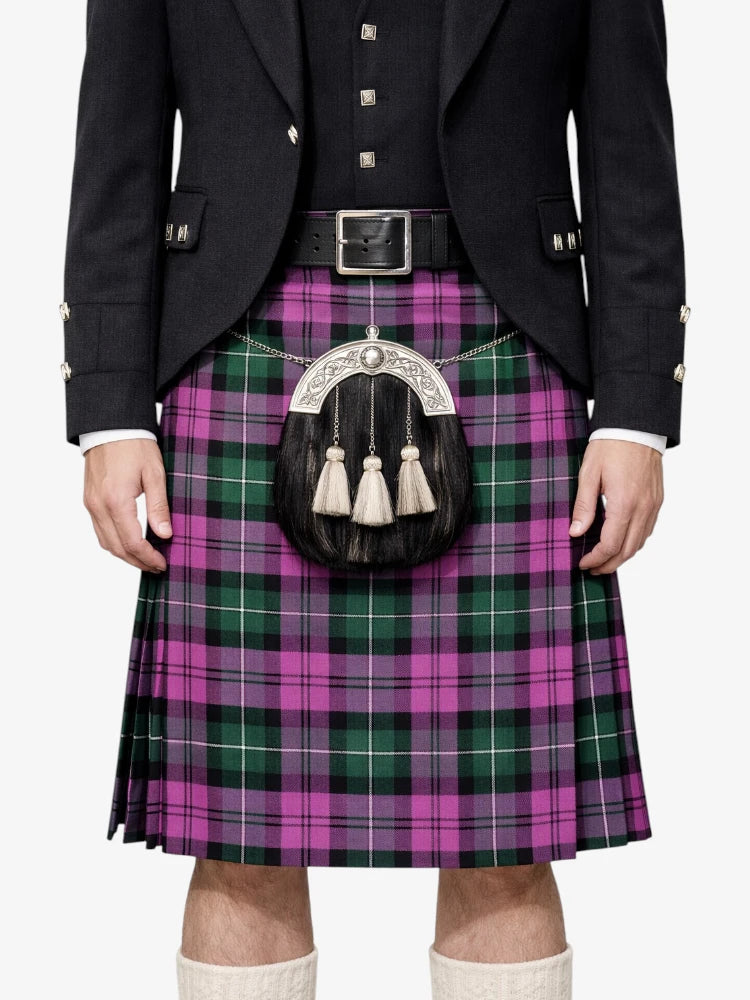Person wearing a Scottish kilt with a tartan pattern on a white background