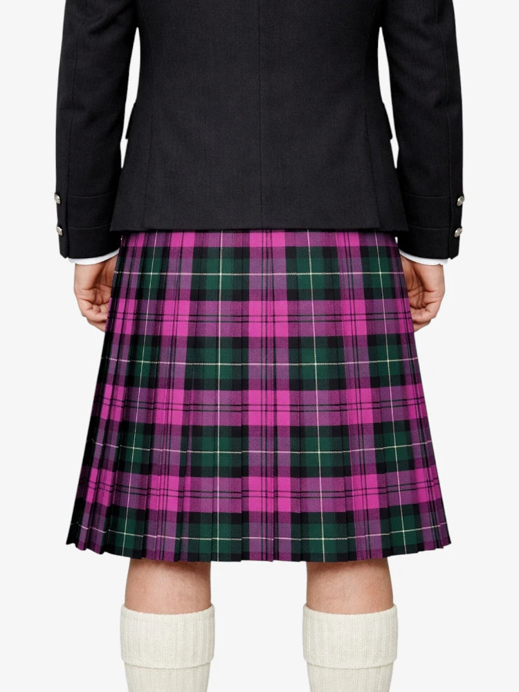 Person wearing a black jacket and pink plaid kilt on a white background