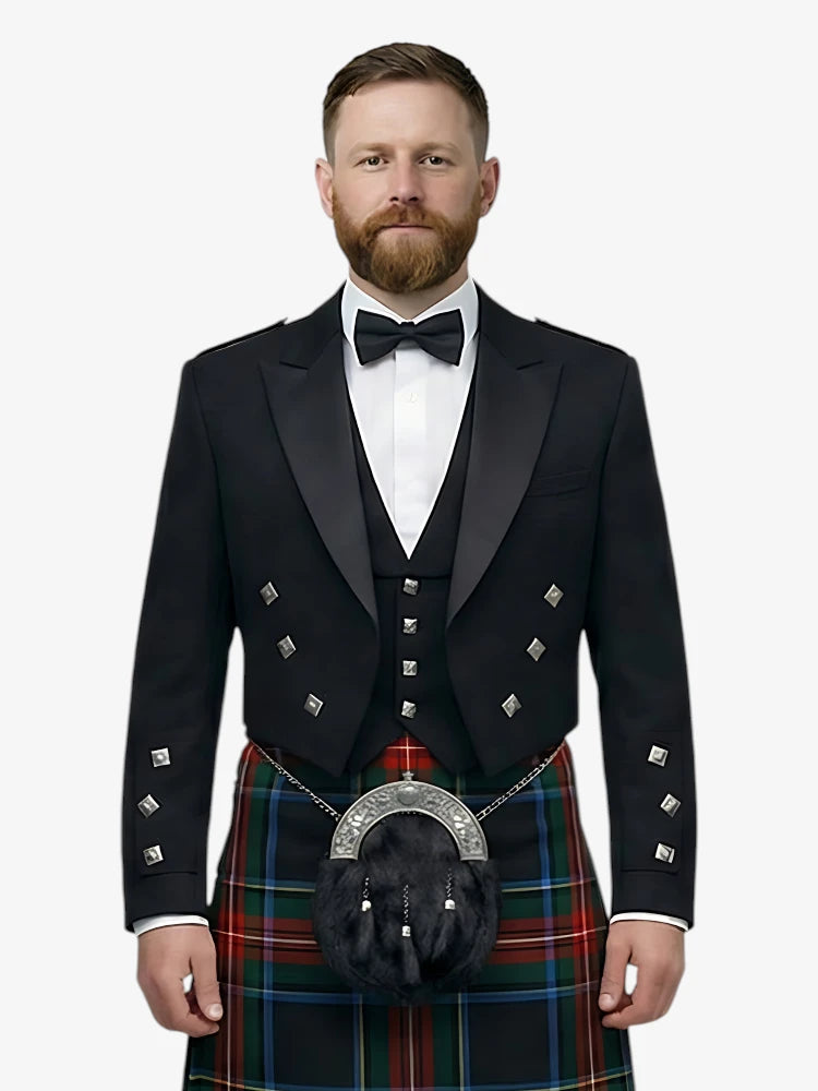 Man wearing a black prince charlie jacket with a black stewart tartan kilt on a white background