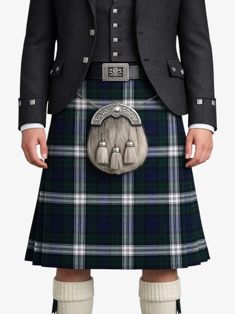 Person wearing a traditional Scottish kilt with a jacket and sporran on a white background