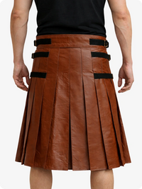 Brown leather kilt with black straps worn by a person on a white background