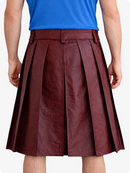 Burgundy pleated skirt worn by a person on a white background