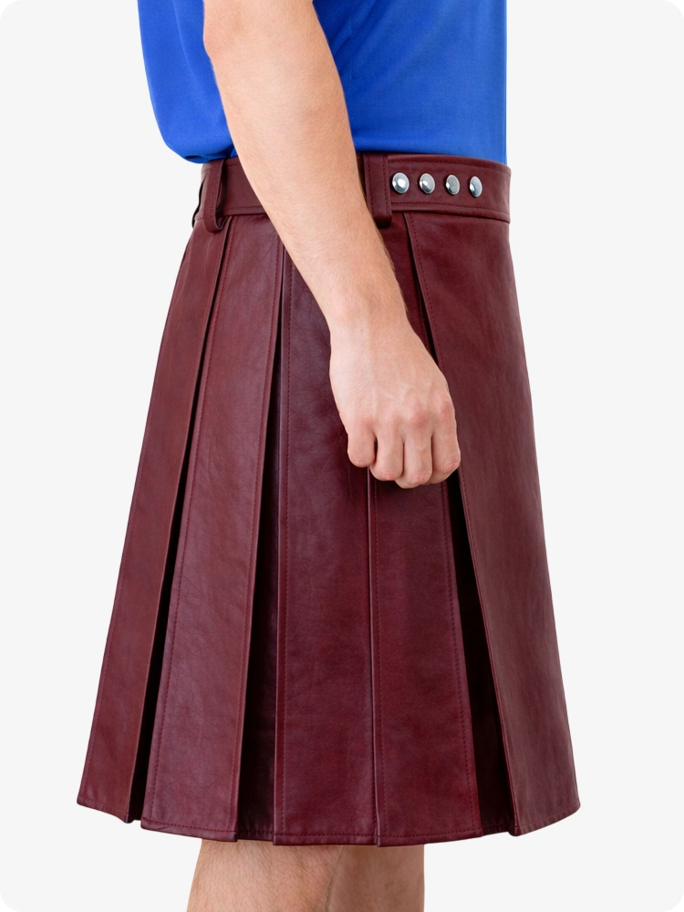 Burgundy pleated skirt worn by a person on a white background