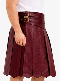 Burgundy leather skirt with gold buckles on a white background