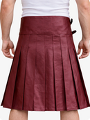 Burgundy pleated skirt worn by a person on a white background