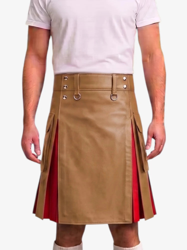 A man wearing a tan faux-leather kilt with red side panels and silver metal hardware, paired with a light pink t-shirt and white socks, against a plain white background.