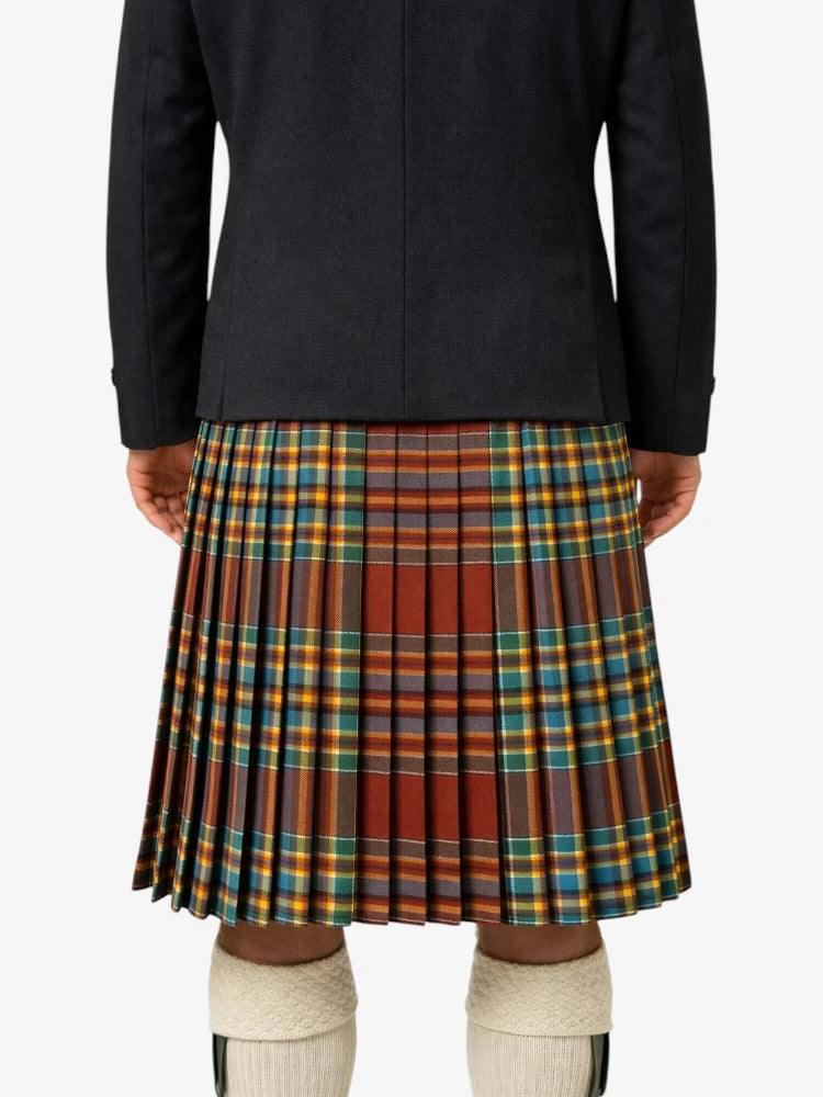 Person wearing a black jacket and plaid kilt on a white background