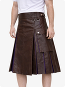 Chocolate Brown leather skirt with metal rings worn by a person on a white background