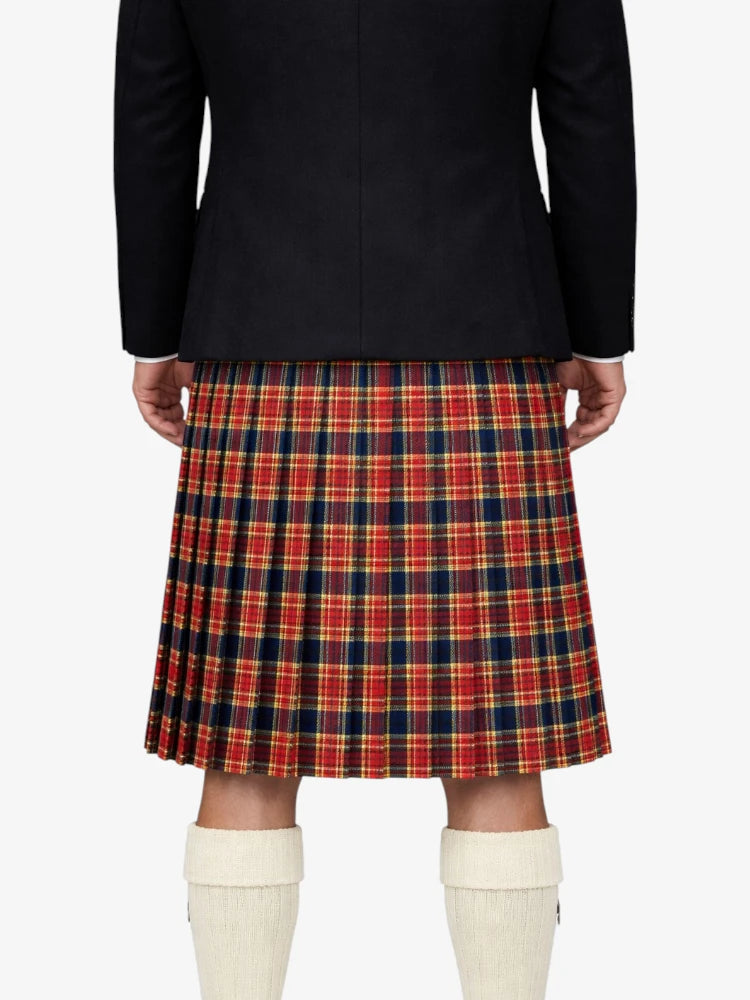 Person wearing a black jacket and red plaid kilt on a white background