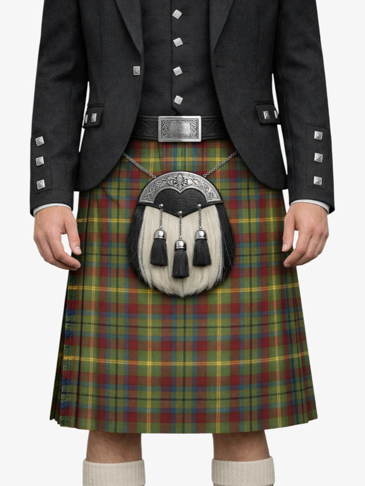 Person wearing a traditional Scottish kilt with a tartan pattern on a white background