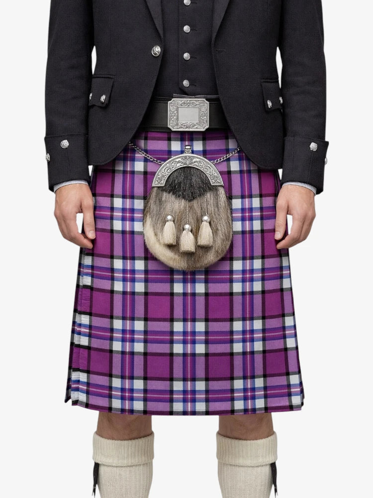 Person wearing a purple plaid kilt with a black jacket on a white background