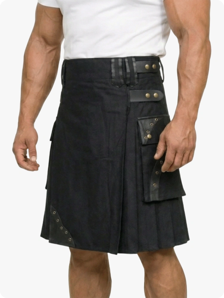 Black kilt worn by a person on a white background