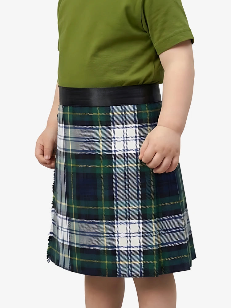Child wearing a green shirt and plaid skirt on a white background