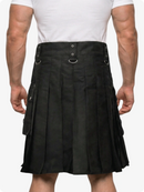 Person wearing a black kilt on a white background