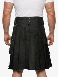 Person wearing a black kilt on a white background