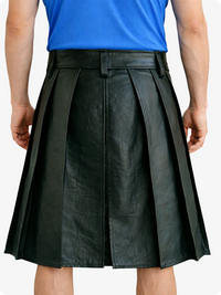 Person wearing a Dark Green pleated skirt and blue top on a white background
