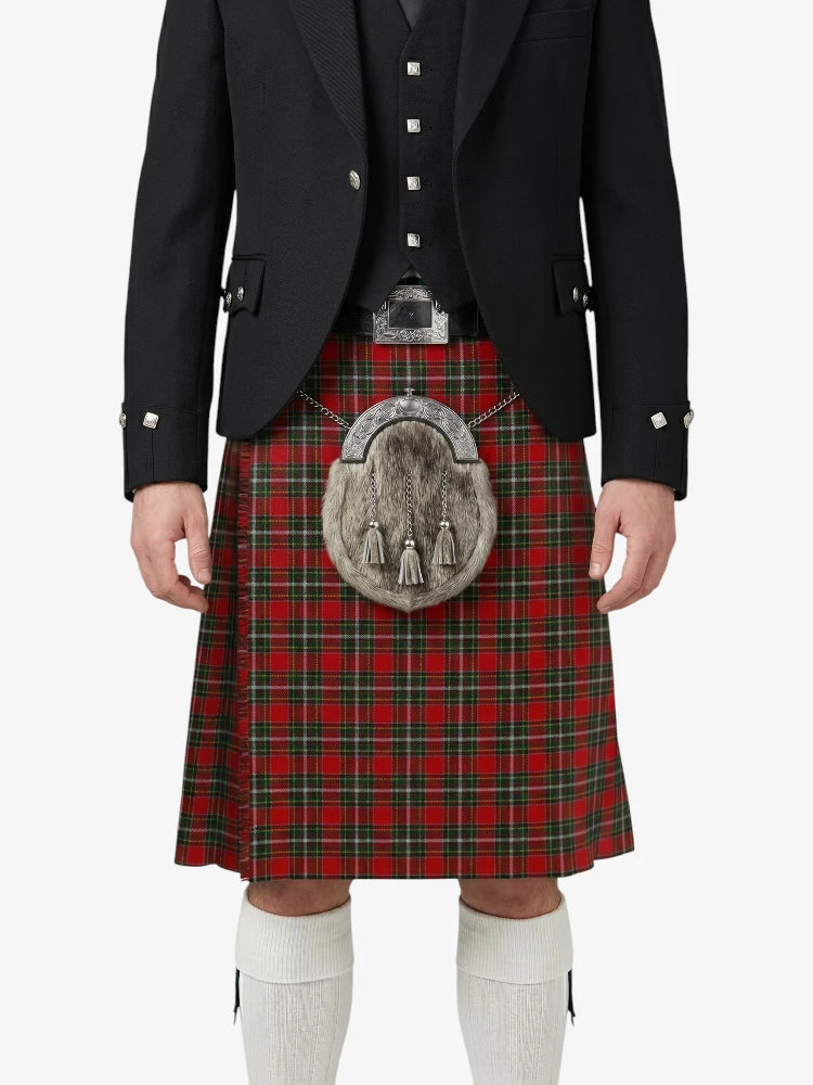 Person wearing a traditional Scottish kilt with a tartan pattern on a white background