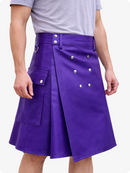 Person wearing a purple kilt with button details on a white background