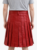 Red pleated skirt worn by a person on a white background