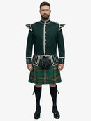 Man wearing a traditional Scottish irish national tartan kilt with a dark green jacket on a white background