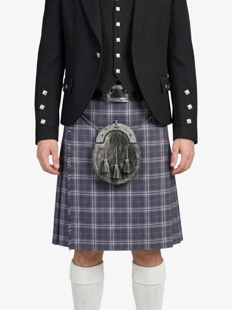 Person wearing a traditional Scottish kilt with a sporran on a white background