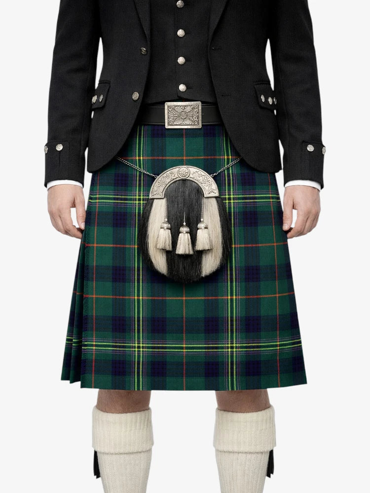 Person wearing a traditional Scottish kilt with a tartan pattern on a white background