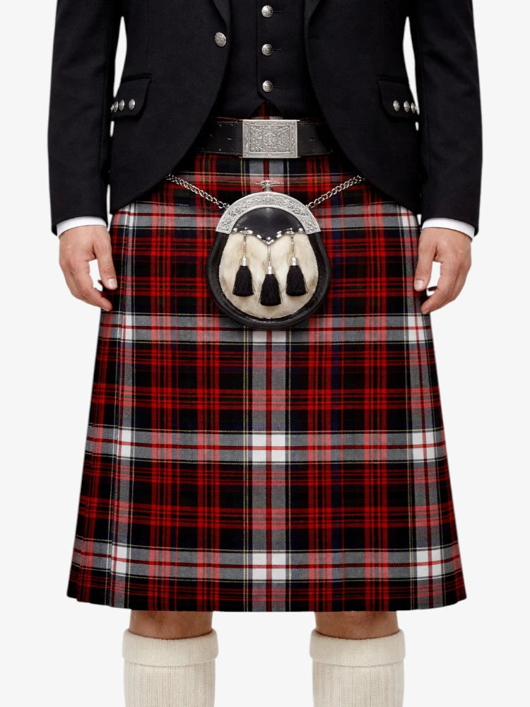 Person wearing a traditional Scottish kilt with a plaid pattern on a white background