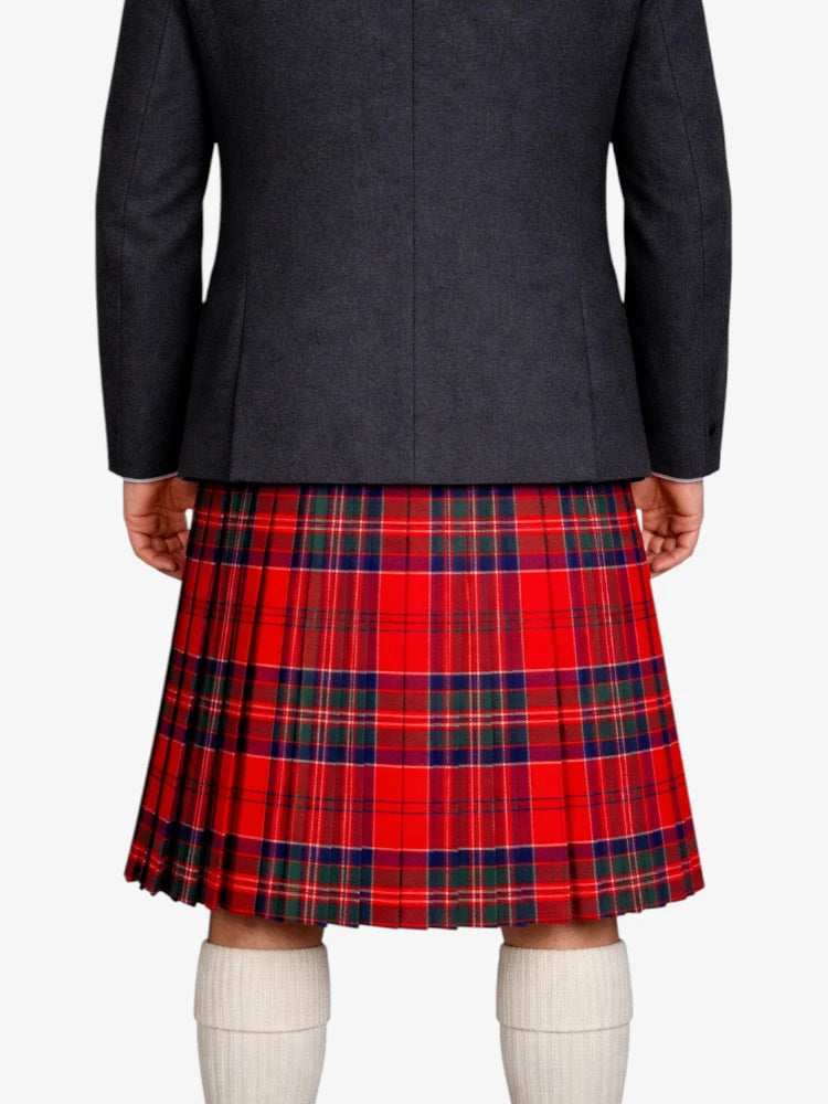 Person wearing a dark gray jacket and red plaid kilt on a white background