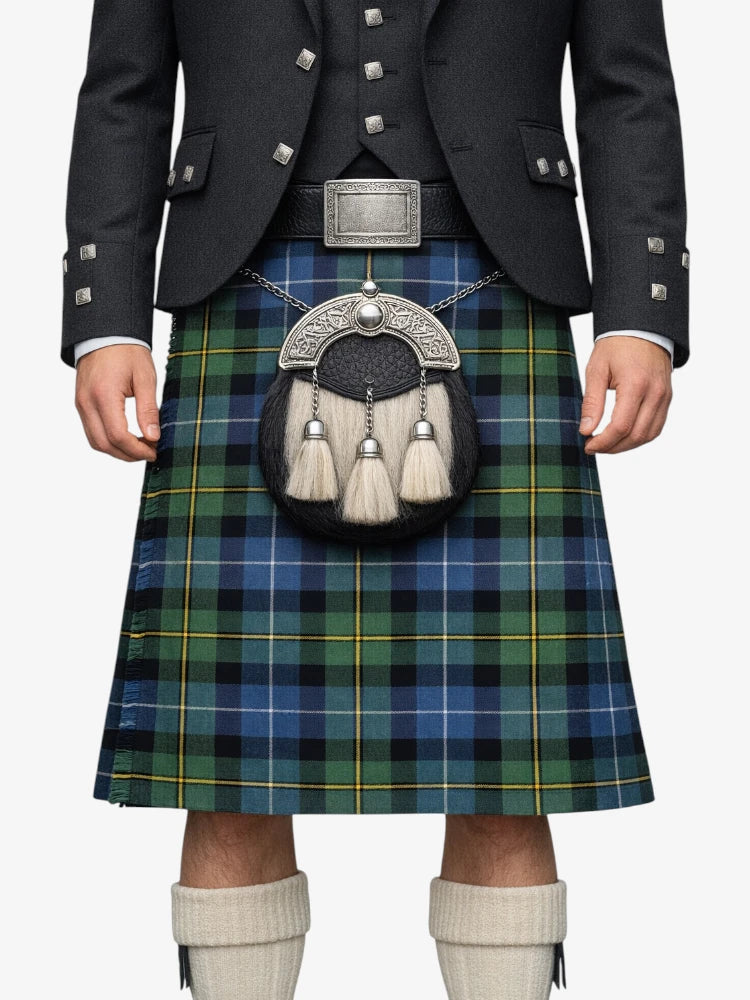 Person wearing a traditional Scottish kilt with a tartan pattern on a white background