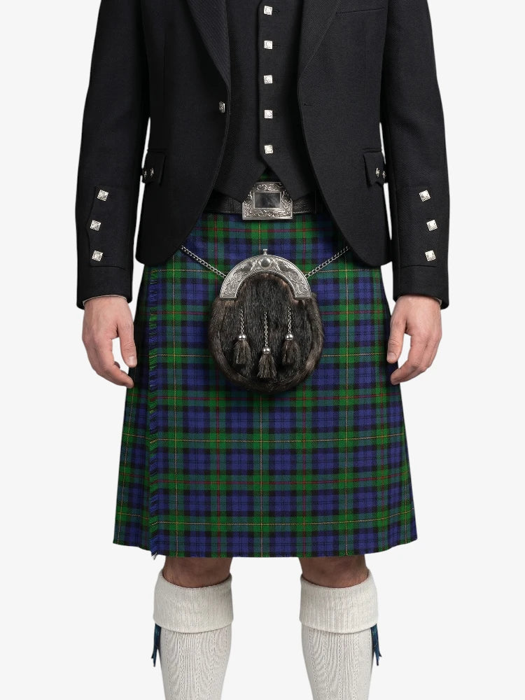 Person wearing a Scottish kilt with a sporran on a white background
