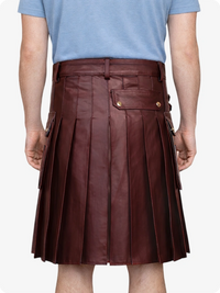 Maroon pleated skirt worn by a person on a white background