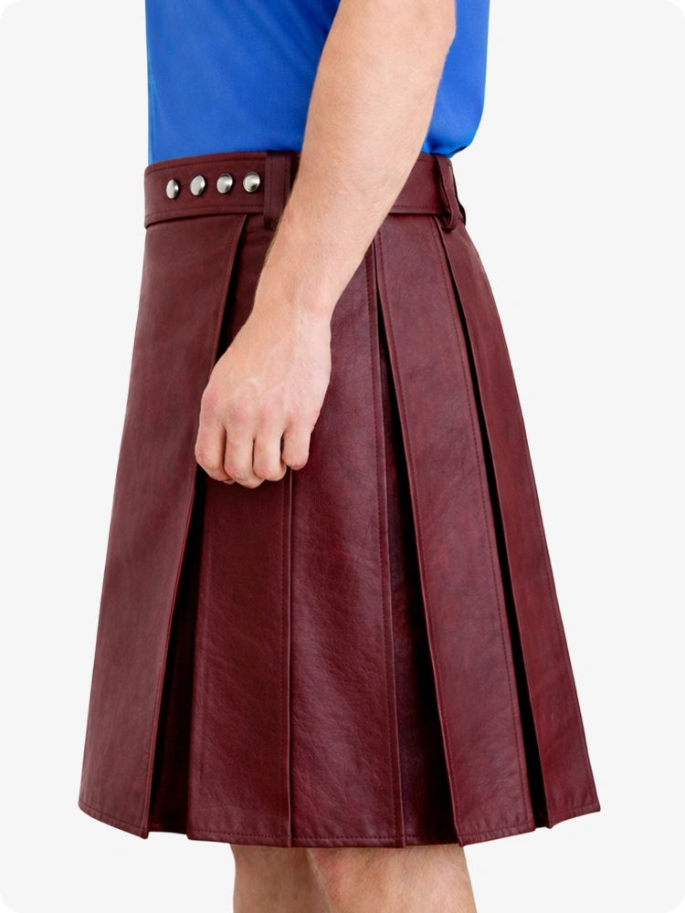 Maroon pleated skirt worn by a person on a white background