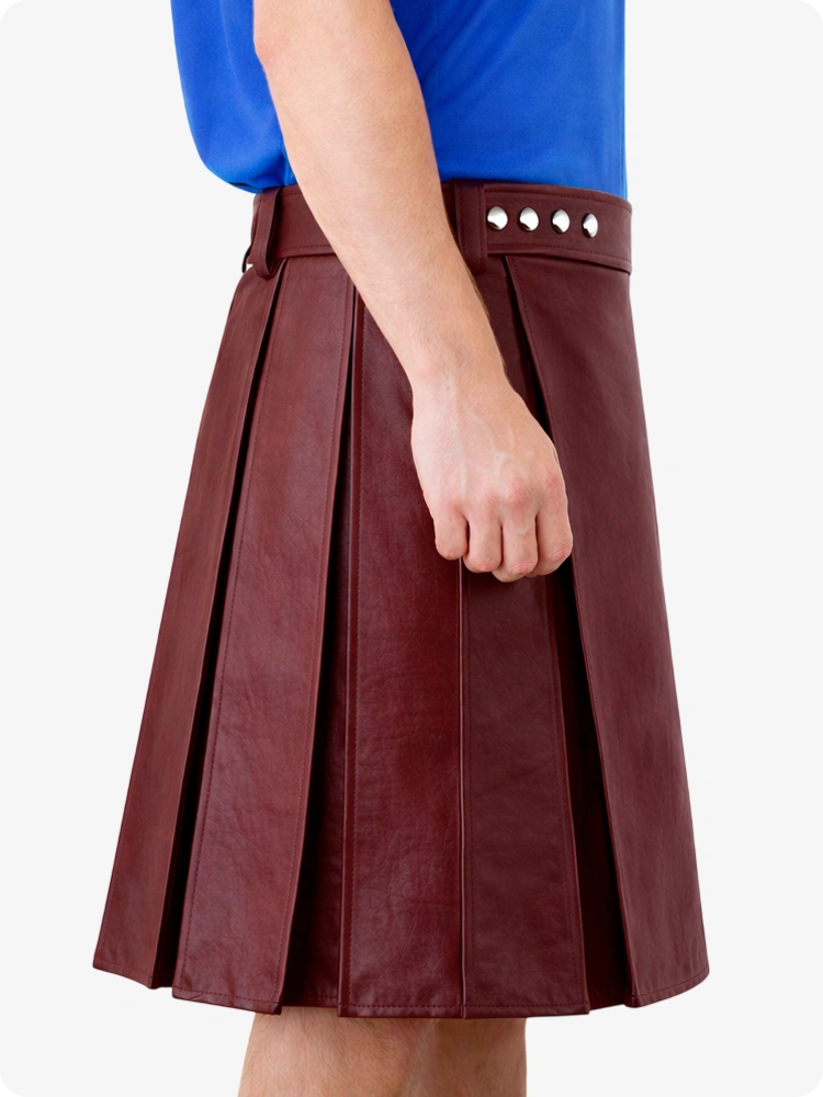 Maroon pleated skirt with decorative buttons worn by a person on a white background