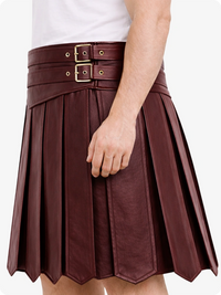 Maroon pleated skirt with belt and gold buckles on a white background