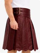 Maroon leather skirt with gold buckle belt on a white background