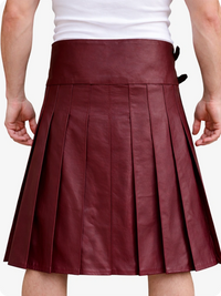 Maroon pleated skirt worn by a person on a white background