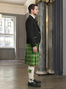 Man wearing a traditional Scottish kilt in a formal setting