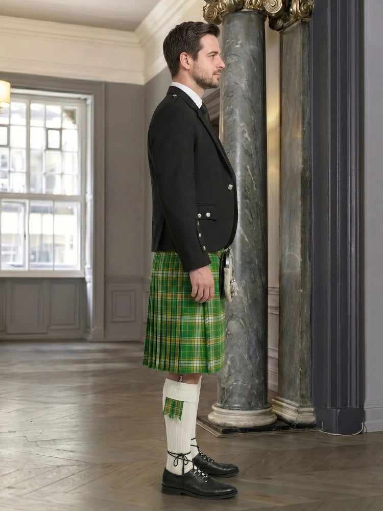 Man wearing a traditional Scottish kilt in a formal setting