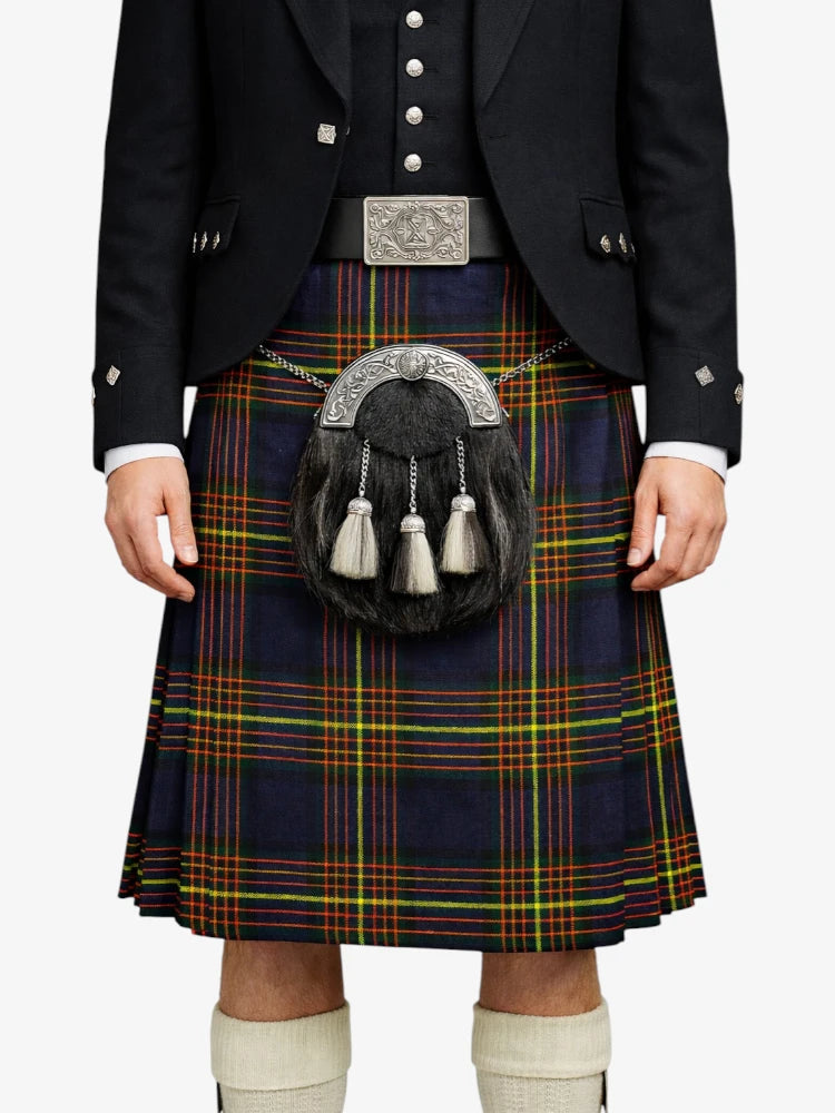 Person wearing a traditional Scottish kilt with a sporran on a white background