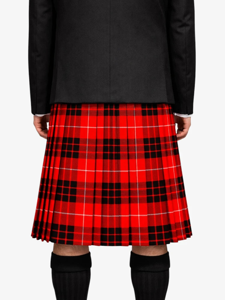 Person wearing a red plaid kilt on a white background