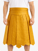 Yellow pleated skirt worn by a person on a white background