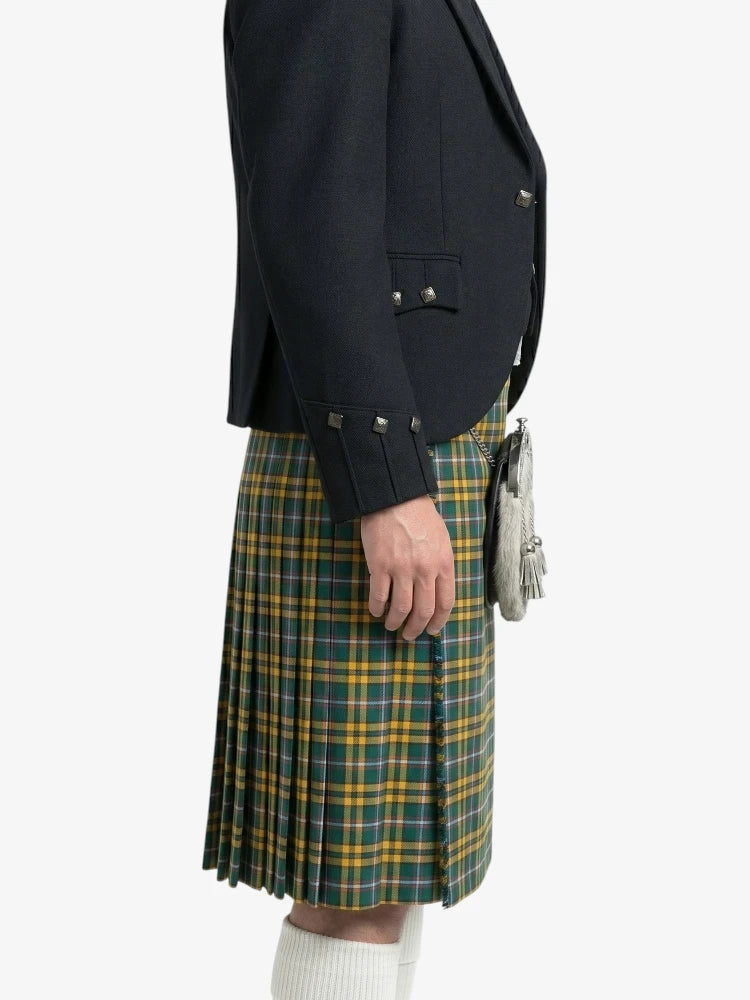 Person wearing a dark jacket and green plaid kilt on a white background