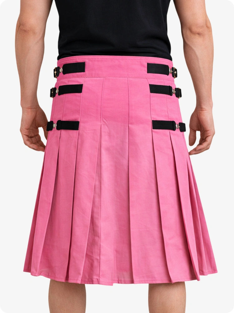 Pink pleated skirt with black accents worn by a person on a white background