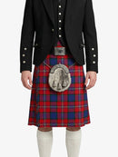 Person wearing a red and blue plaid kilt with a black jacket on a white background