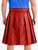 Red pleated skirt worn by a person on a white background
