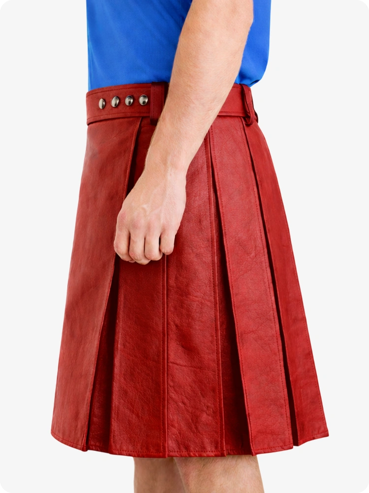 Red pleated skirt worn by a person on a white background
