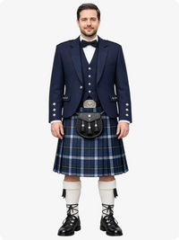 Man wearing a traditional Scottish kilt with a navy jacket and white socks on a white background
