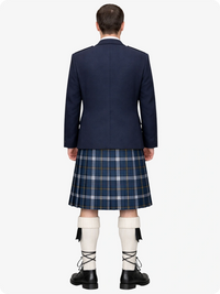 Person wearing a navy blazer and plaid kilt on a white background