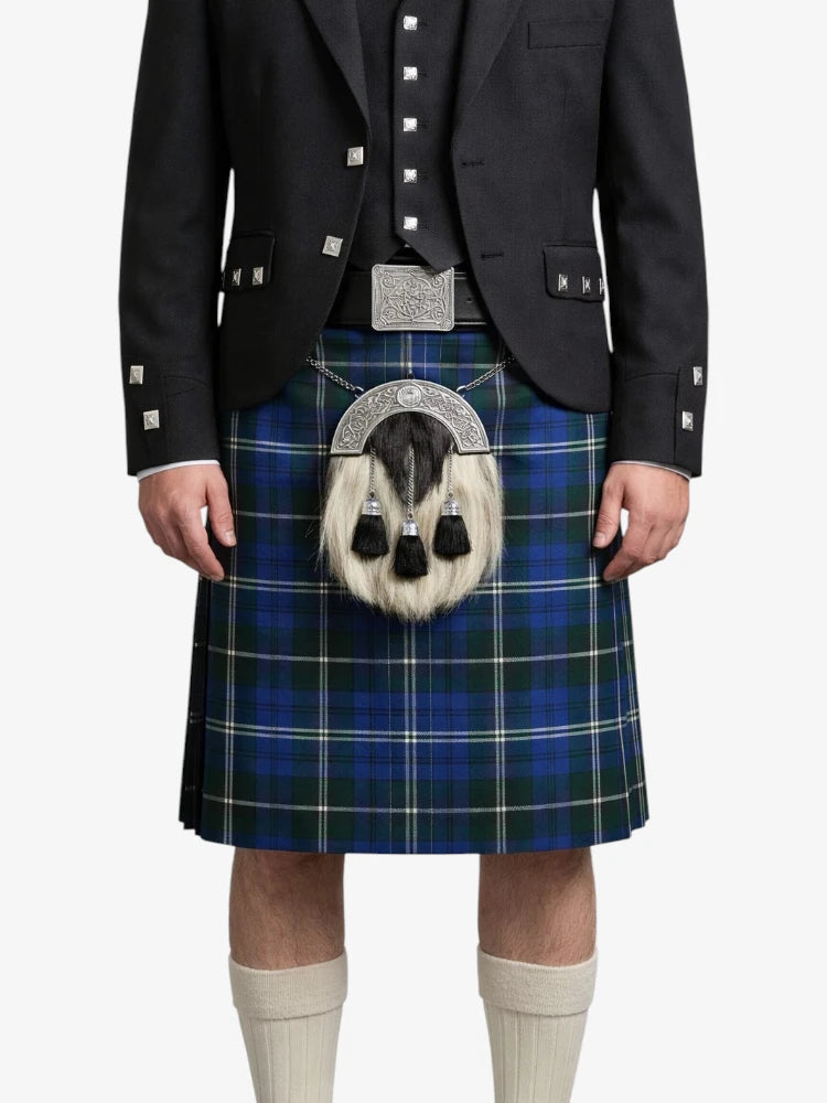 Person wearing a blue plaid kilt with a black jacket on a white background
