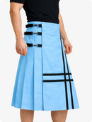 Sky blue skirt with black straps and plaid pattern worn by a person on a white background